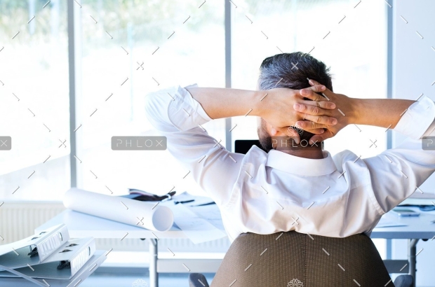 demo-attachment-135-Businessman-at-the-desk-in-his-office-resting.